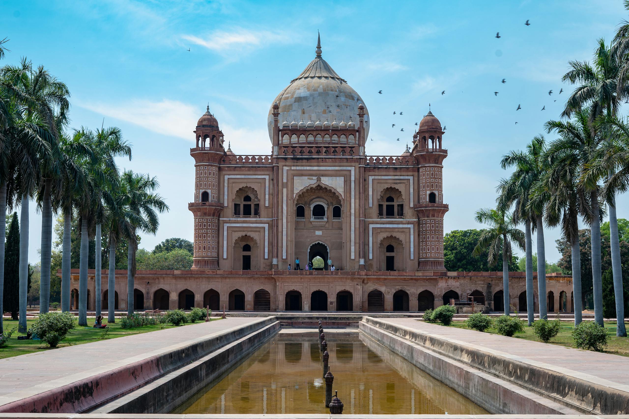 Beautiful view of Safdarjung's Tomb and garden, showcasing Mughal architecture under a clear blue sky.