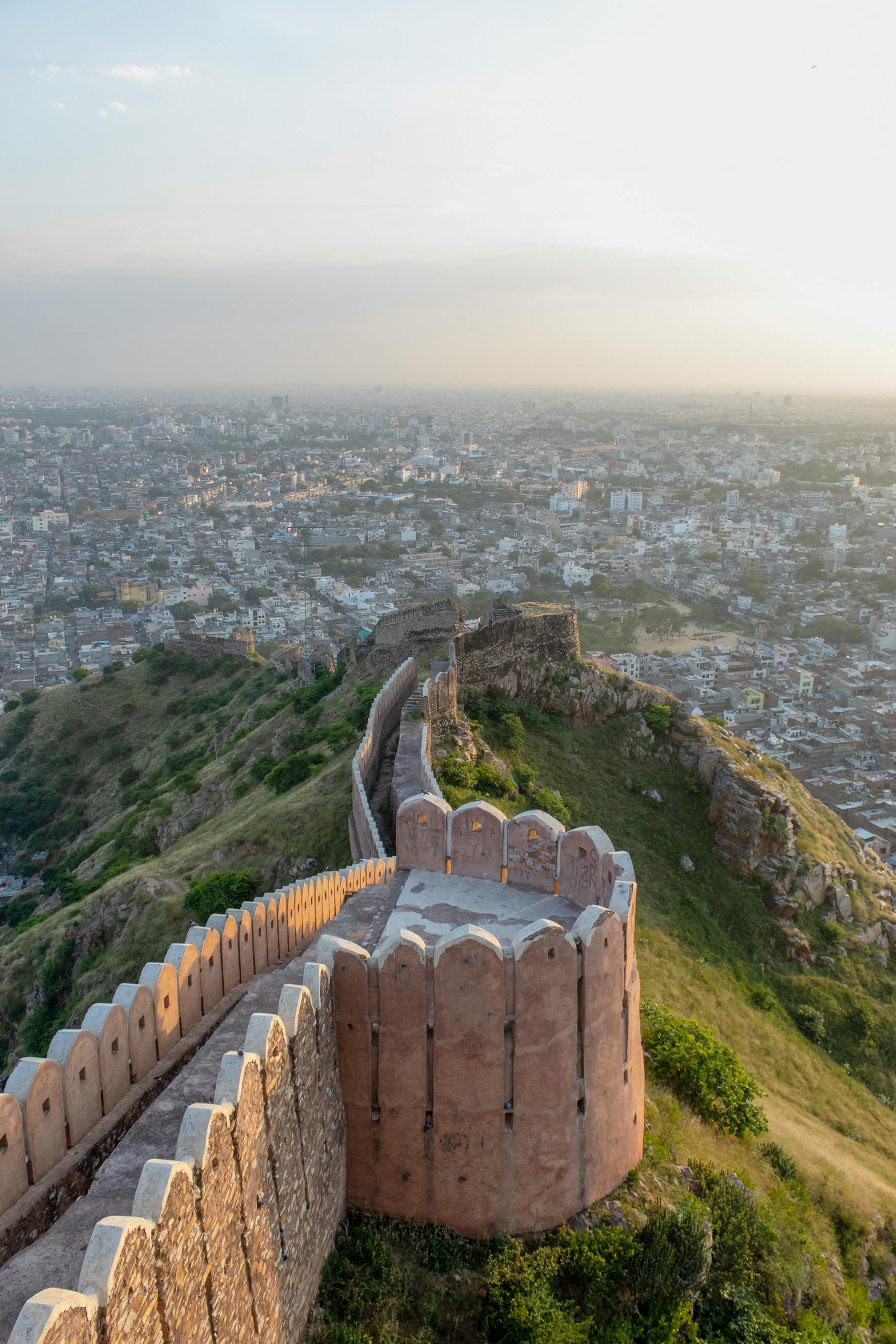 Scenic view of Nahargarh Fort wall over Jaipur city, showcasing historic architecture and landscape.